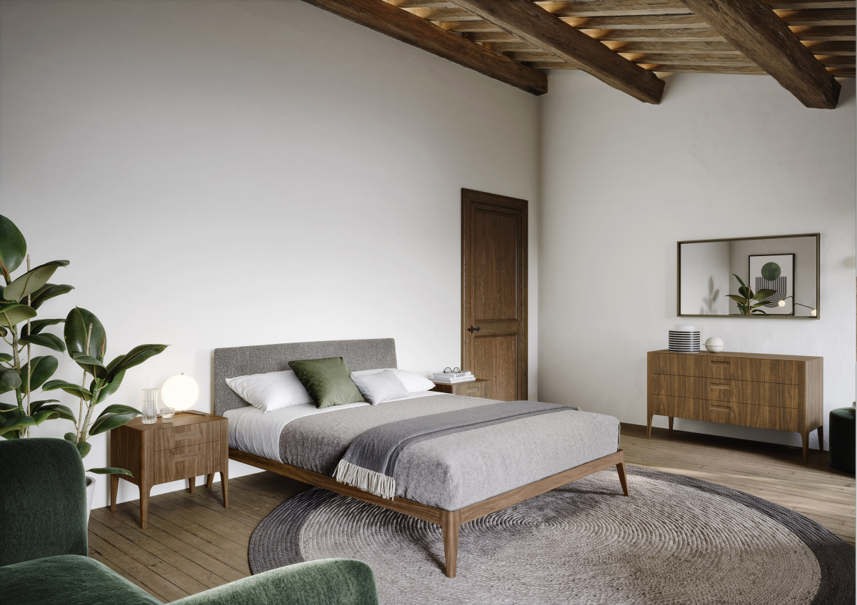 Ložnice vybavená nábytkem od italské značky Novamobili. V interiéru vládnou přírodní materiály v čele s tmavým dřevem. 